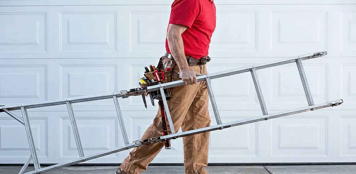 Garage door repair technician arriving with tools and ladder in Jersey City, NJ